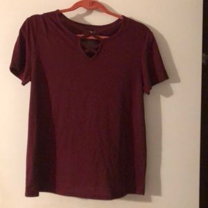 Burgundy shirt with crisscross cutout at neckline
